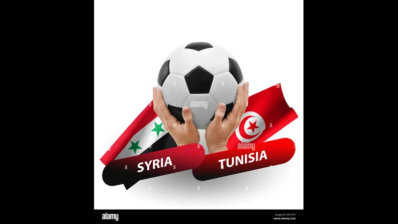 Cầu thủ Tunisia đi bóng qua cầu thủ Syria trong trận đấu sôi động Cầu thủ Tunisia đi bóng qua cầu thủ Syria trong trận đấu sôi động
